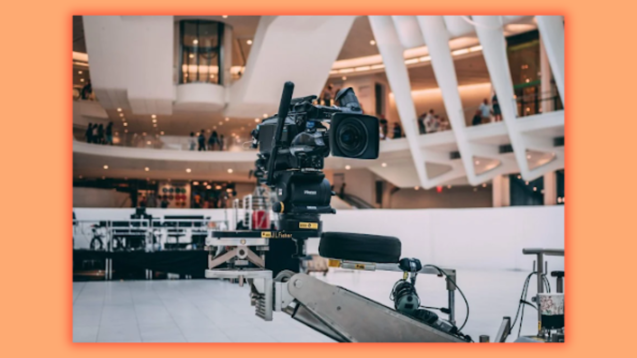 a close up of a camera while there are people in the background