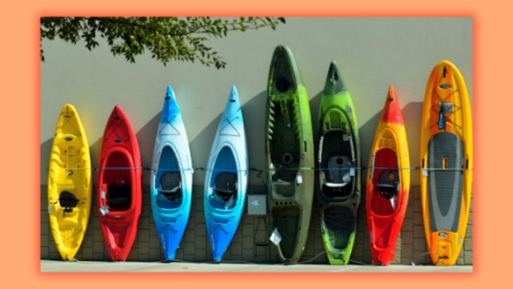 several kayaks being parked at the bank of a river