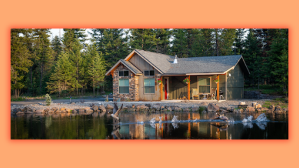 an image of a house in front of which there is a pond in which ducks are swimming. 