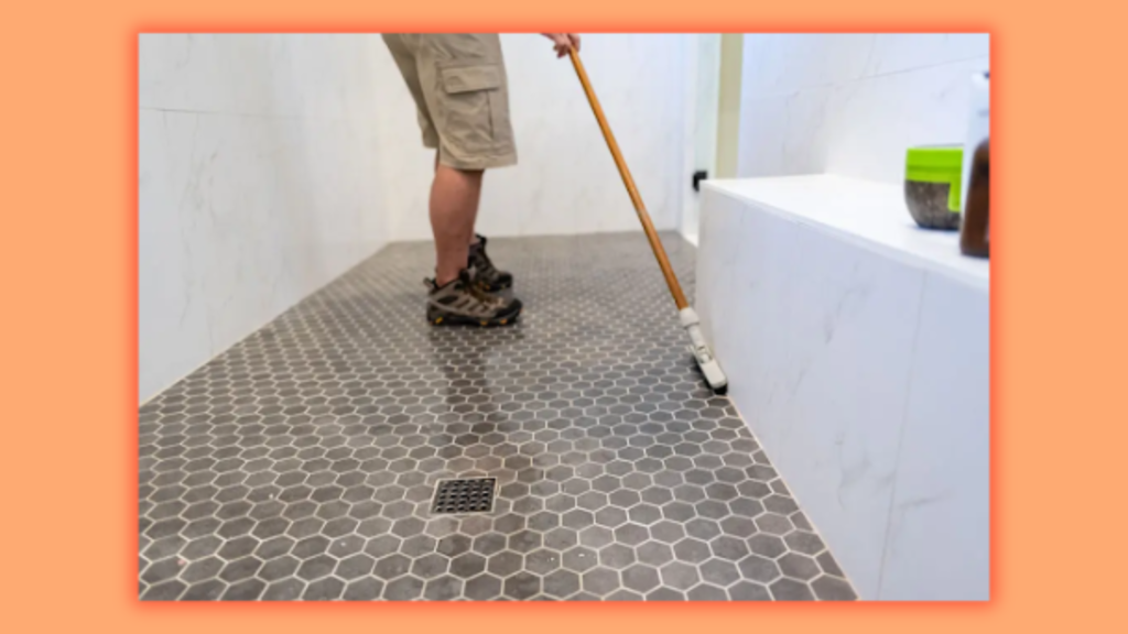 a man cleaning tiles
