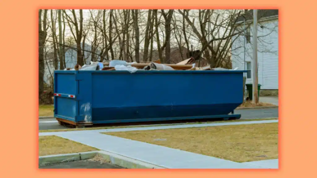 an image of dumpster filled with trash with trees in the background