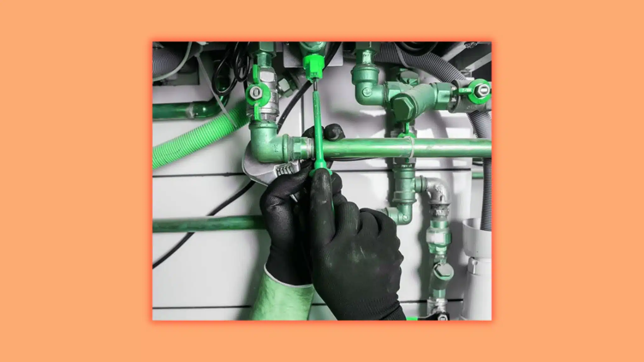 an image showing a person working on a pipe looks like he is a plumber